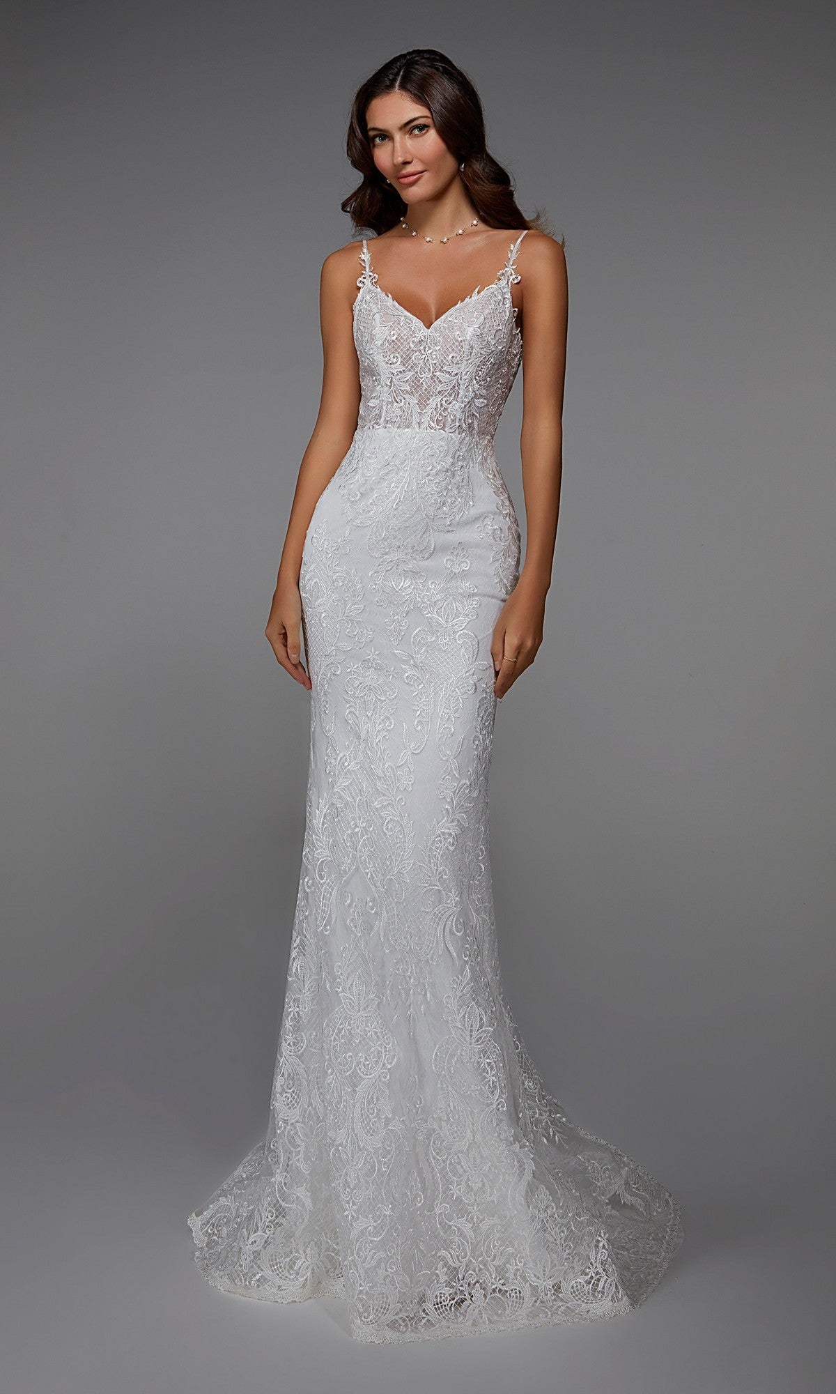 A woman in the Alyce 7028 Long White Dress, an ivory, fitted sleeveless gown with lace embroidery and a slight train, poses against a plain grey background—ideal for formal events.